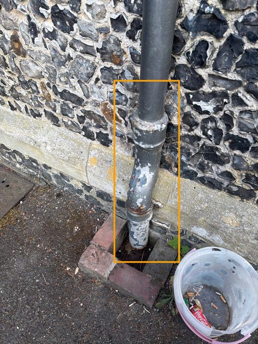 External water pipe marked for repair and repaint
